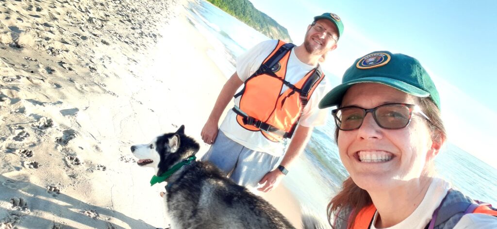People on a beach with dog