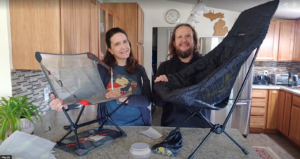 two people with camping chairs in a kitchen